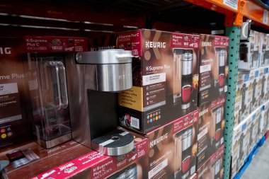 Los Angeles, California, United States - 05-20-2022: A view of several cases of Keurig K-Supreme Plus coffee appliances, on display at a local big box grocery store.