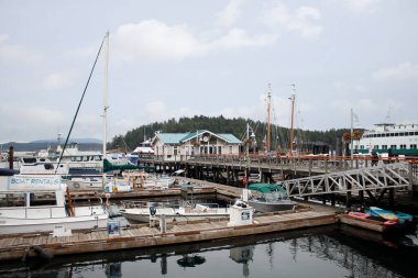Friday Harbor, Washington, United States - 09-11-2021: A view looking at the Spring Street Landing boardwalk, leading to the marina.