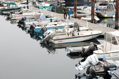 Friday Harbor, Washington, United States - 09-11-2021: A view of several motor boats parked on a dock.