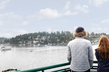 Friday Harbor, Washington, United States - 09-11-2021: A view of people enjoying the open deck of a ferry boat.