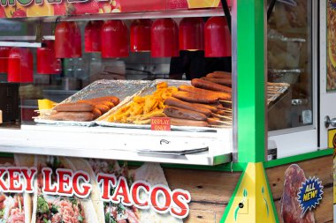 Los Angeles, California, United States - 05-30-2022: A view of a vendor showing carnival food in the window, featuring corn dogs.