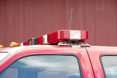 Puyallup, Washington, United States - 09-13-2021: A view of Whelen flashing lights attached to the top of a city emergency fire safety vehicle.