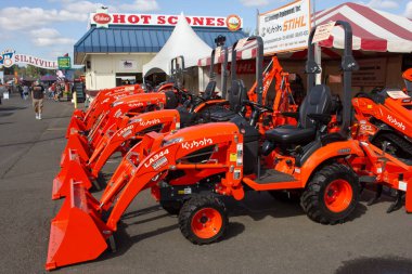 Puyallup, Washington, United States - 09-13-2021: A view of a variety of Kubota residential tractor units, on display at a local fair.