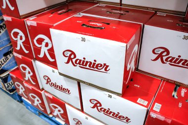 Seattle, Washington, United States - 09-13-2021: A view of several cases of Rainier beer cans, on display at a local grocery store.