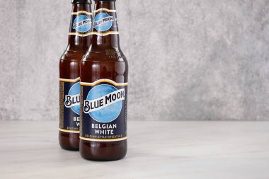 Los Angeles, California, United States - 03-01-2022: A view of some bottles of Blue Moon Belgian White beer.