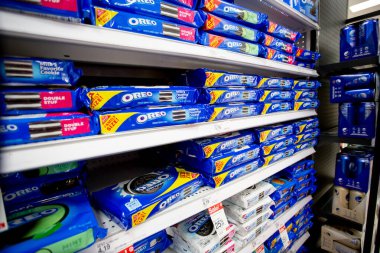 Los Angeles, California, United States - 05-20-2022: A view of several shelves dedicated to Oreo cookie products, on display at a local grocery store. clipart