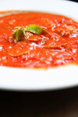 A view of a plate of sausage and peppers.