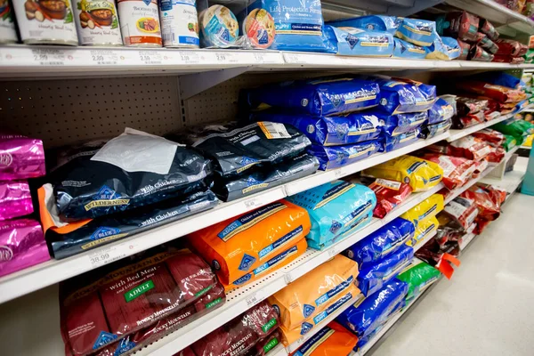 stock image Los Angeles, California, United States - 05-20-2022: A view of several shelves dedicated to popular brands of dog food, on display at a local department store.