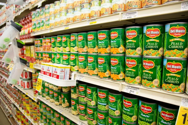 stock image Los Angeles, California, United States - 05-20-2022: A view of several shelves dedicated to Del Monte canned vegetables, on display at a local grocery store.