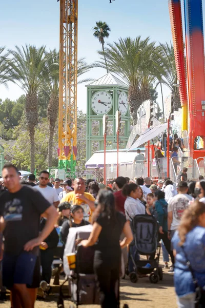 stock image Garden Grove, California, United States - 05-30-2022: A view of a crowd walking around the attractions, seen at the Strawberry Festival.