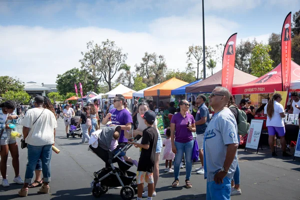 stock image Los Angeles, California, United States - 05-20-2022: A view of people walking around the Spicy Green Book Food Market.