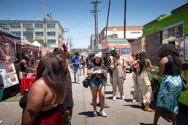 stock image Los Angeles, California, United States - 05-20-2022: A view of people walking around the Black on the Block festival.