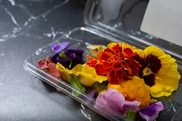 A view of a package of edible flowers.