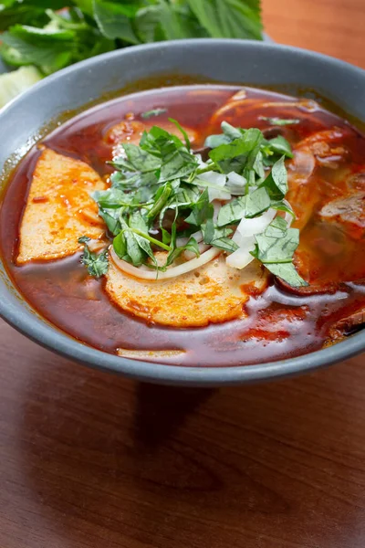 stock image A view of a bowl of bun bo hue.