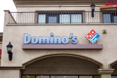 Los Angeles, California, United States - 03-01-2019: A view of a store front sign for the pizza delivery company known as Domino's.