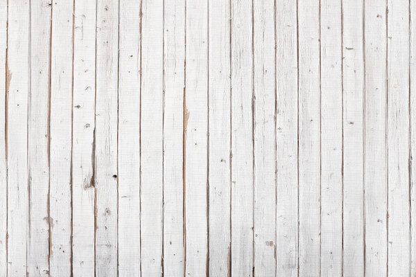 A view of a grungy white painted wood background.