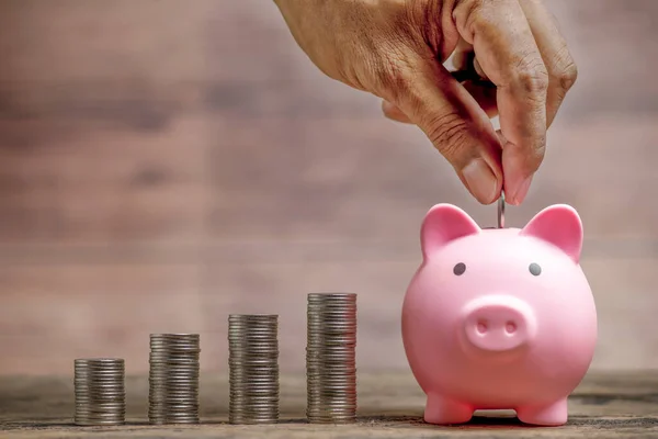 Save money and account banking for finance concept, Piggy bank with coin on blurred background, Save Monney for Investors Using Internet to Trade Stocks or Trade Fund