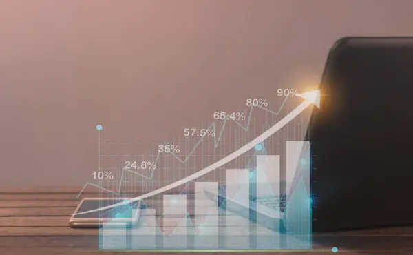 stock image Table with laptop and smartphone with investment graph of businessman using technology and internet for investment