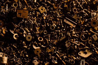 Cıvataların, fındıkların, vidaların, yıkamacıların ve metal parçaların arka planı