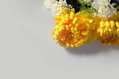 Sympathy card with chrysanthemum flowers and copy space. Condolence background concept.