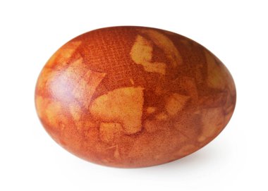 Easter egg dyed with onion skin isolated on white background. Natural Easter concept. Easter egg decorated with heart shape, marble effect.