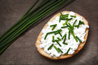 Cottage cheese and chives on toast clipart