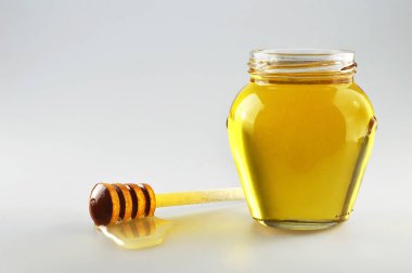 Honey jar with wooden honey dipper