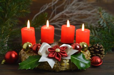 Advent wreath with four burning candles on it. Christmas decoration clipart