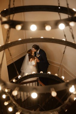 young couple bride and groom in a white dress walking