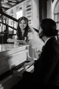 young couple bride and groom in a white dress walking
