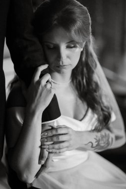 young couple bride and groom in a white dress walking