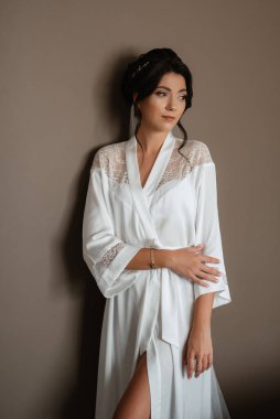 morning of the bride with the creation of the image of makeup and the creation of hairstyles