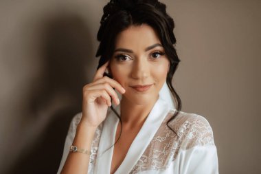 morning of the bride with the creation of the image of makeup and the creation of hairstyles