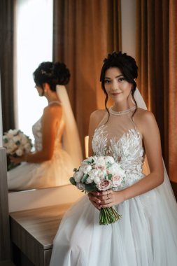 morning of the bride with the creation of the image of makeup and the creation of hairstyles