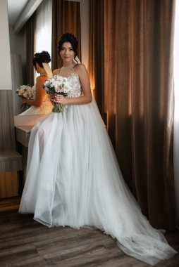 morning of the bride with the creation of the image of makeup and the creation of hairstyles