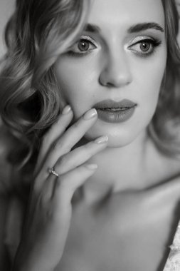 morning of the bride with the creation of the image of makeup and the creation of hairstyles