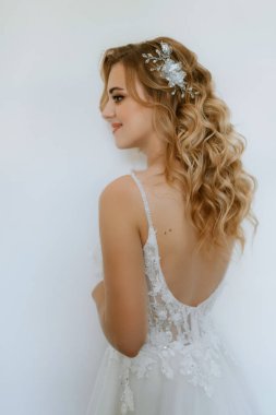morning of the bride with the creation of the image of makeup and the creation of hairstyles
