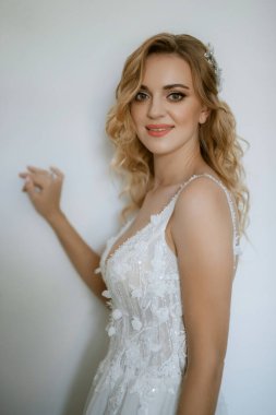 morning of the bride with the creation of the image of makeup and the creation of hairstyles