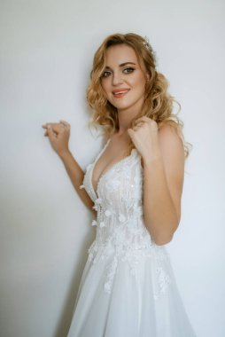 morning of the bride with the creation of the image of makeup and the creation of hairstyles