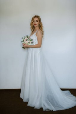 morning of the bride with the creation of the image of makeup and the creation of hairstyles