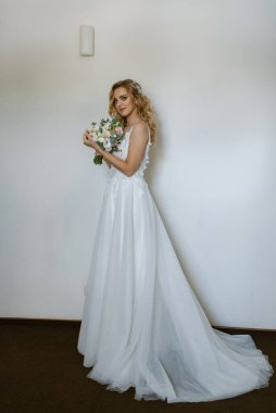 morning of the bride with the creation of the image of makeup and the creation of hairstyles