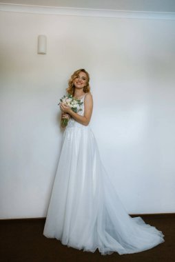 morning of the bride with the creation of the image of makeup and the creation of hairstyles