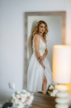 morning of the bride with the creation of the image of makeup and the creation of hairstyles