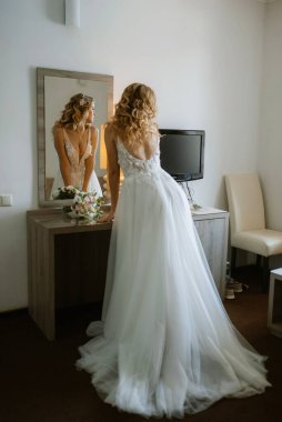 morning of the bride with the creation of the image of makeup and the creation of hairstyles