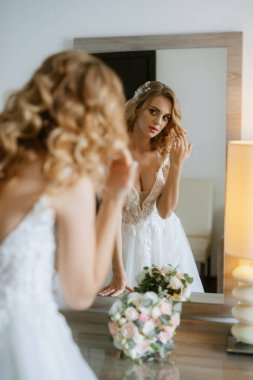 morning of the bride with the creation of the image of makeup and the creation of hairstyles