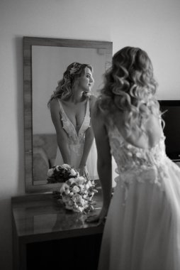 morning of the bride with the creation of the image of makeup and the creation of hairstyles