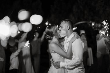 newlyweds at a wedding in the corridor of sparklers