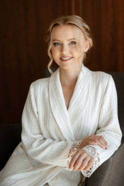 morning of the bride with the creation of the image of makeup and the creation of hairstyles