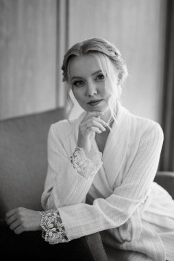 morning of the bride with the creation of the image of makeup and the creation of hairstyles