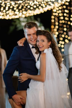 newlyweds at a wedding in the corridor of sparklers